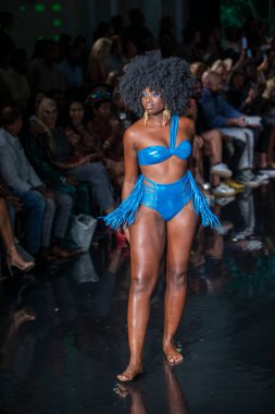 A model walks the runway for Bikini Beach Australia Fashion Show during Art, Hearts, Fashion Swim Week at the Faena Forum in Miami Beach on 7- 11- 2021