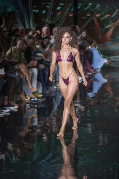 A model walks the runway for Bikini Beach Australia Fashion Show during Art, Hearts, Fashion Swim Week at the Faena Forum in Miami Beach on 7- 11- 2021