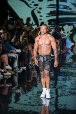 A model walks the runway for House of Skye Sexy Black Bra Fashion Show during Art, Hearts, Fashion Swim Week at the Faena Forum in Miami Beach on 7- 11- 2021