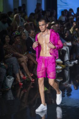 A model walks the runway for House of Skye Sexy Black Bra Fashion Show during Art, Hearts, Fashion Swim Week at the Faena Forum in Miami Beach on 7- 11- 2021