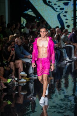 A model walks the runway for House of Skye Sexy Black Bra Fashion Show during Art, Hearts, Fashion Swim Week at the Faena Forum in Miami Beach on 7- 11- 2021