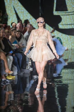 A model walks the runway for House of Skye Sexy Black Bra Fashion Show during Art, Hearts, Fashion Swim Week at the Faena Forum in Miami Beach on 7- 11- 2021