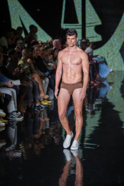 A model walks the runway for House of Skye Sexy Black Bra Fashion Show during Art, Hearts, Fashion Swim Week at the Faena Forum in Miami Beach on 7- 11- 2021