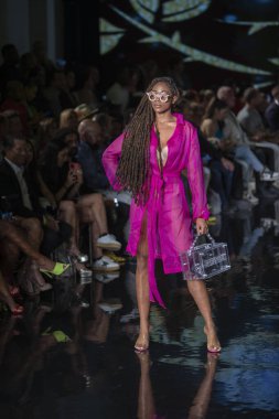 A model walks the runway for House of Skye Sexy Black Bra Fashion Show during Art, Hearts, Fashion Swim Week at the Faena Forum in Miami Beach on 7- 11- 2021