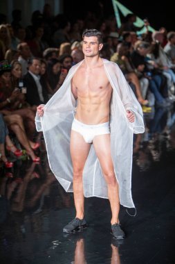 A model walks the runway for the House of Skye Sexy Black Bra Fashion Show during Art, Hearts, Fashion Swim Week at the Faena Forum in Miami Beach on 7- 11- 2021