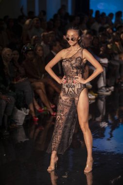 A model walks the runway for the House of Skye Sexy Black Bra Fashion Show during Art, Hearts, Fashion Swim Week at the Faena Forum in Miami Beach on 7- 11- 2021