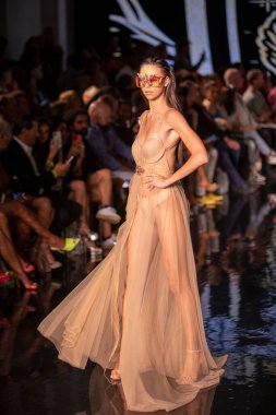 A model walks the runway for the House of Skye Sexy Black Bra Fashion Show during Art, Hearts, Fashion Swim Week at the Faena Forum in Miami Beach on 7- 11- 2021