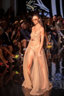 A model walks the runway for the House of Skye Sexy Black Bra Fashion Show during Art, Hearts, Fashion Swim Week at the Faena Forum in Miami Beach on 7- 11- 2021