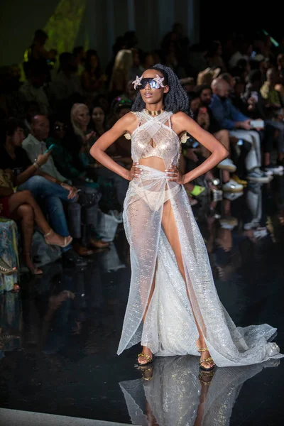 A model walks the runway for the House of Skye Sexy Black Bra Fashion Show during Art, Hearts, Fashion Swim Week at the Faena Forum in Miami Beach on 7- 11- 2021