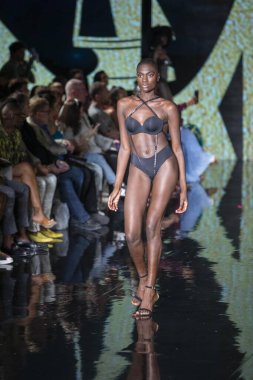 A model walks the runway for the House of Skye Sexy Black Bra Fashion Show during Art, Hearts, Fashion Swim Week at the Faena Forum in Miami Beach on 7- 11- 2021