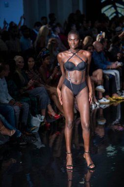 A model walks the runway for the House of Skye Sexy Black Bra Fashion Show during Art, Hearts, Fashion Swim Week at the Faena Forum in Miami Beach on 7- 11- 2021