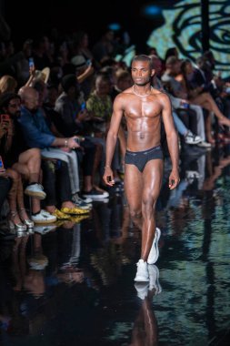 A model walks the runway for the House of Skye Sexy Black Bra Fashion Show during Art, Hearts, Fashion Swim Week at the Faena Forum in Miami Beach on 7- 11- 2021