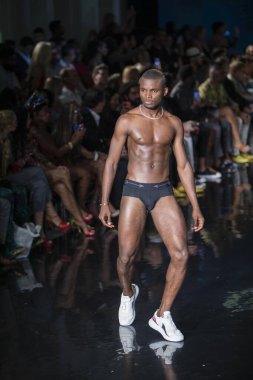 A model walks the runway for the House of Skye Sexy Black Bra Fashion Show during Art, Hearts, Fashion Swim Week at the Faena Forum in Miami Beach on 7- 11- 2021