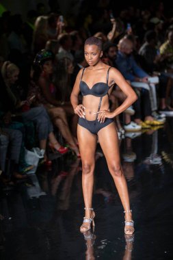 A model walks the runway for the House of Skye Sexy Black Bra Fashion Show during Art, Hearts, Fashion Swim Week at the Faena Forum in Miami Beach on 7- 11- 2021