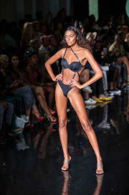 A model walks the runway for the House of Skye Sexy Black Bra Fashion Show during Art, Hearts, Fashion Swim Week at the Faena Forum in Miami Beach on 7- 11- 2021