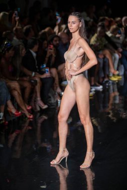 A model walks the runway for the House of Skye Sexy Black Bra Fashion Show during Art, Hearts, Fashion Swim Week at the Faena Forum in Miami Beach on 7- 11- 2021