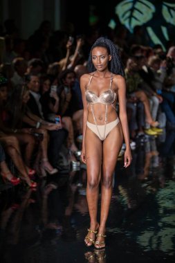 A model walks the runway for the House of Skye Sexy Black Bra Fashion Show during Art, Hearts, Fashion Swim Week at the Faena Forum in Miami Beach on 7- 11- 2021