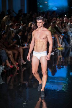 A model walks the runway for the House of Skye Sexy Black Bra Fashion Show during Art, Hearts, Fashion Swim Week at the Faena Forum in Miami Beach on 7- 11- 2021