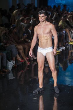 A model walks the runway for the House of Skye Sexy Black Bra Fashion Show during Art, Hearts, Fashion Swim Week at the Faena Forum in Miami Beach on 7- 11- 2021