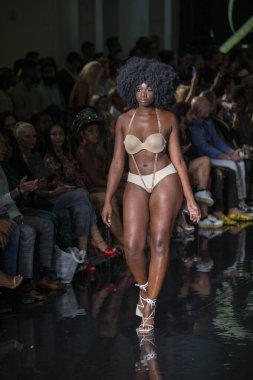 A model walks the runway for the House of Skye Sexy Black Bra Fashion Show during Art, Hearts, Fashion Swim Week at the Faena Forum in Miami Beach on 7- 11- 2021