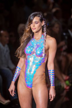 A model walks the runway for the Black Tape Project Fashion Show during Art, Hearts, Fashion Swim Week at the Faena Forum in Miami Beach on 7- 11- 2021