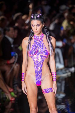 A model walks the runway for the Black Tape Project Fashion Show during Art, Hearts, Fashion Swim Week at the Faena Forum in Miami Beach on 7- 11- 2021