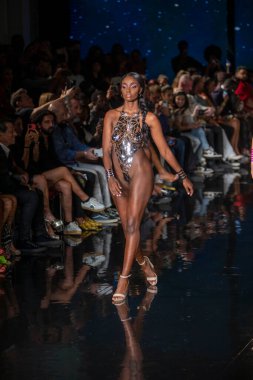 A model walks the runway for the Black Tape Project Fashion Show during Art, Hearts, Fashion Swim Week at the Faena Forum in Miami Beach on 7- 11- 2021