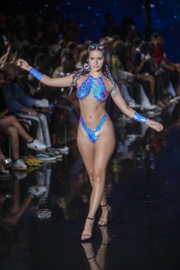 A model walks the runway for the Black Tape Project Fashion Show during Art, Hearts, Fashion Swim Week at the Faena Forum in Miami Beach on 7- 11- 2021