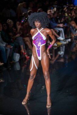 A model walks the runway for the Black Tape Project Fashion Show during Art, Hearts, Fashion Swim Week at the Faena Forum in Miami Beach on 7- 11- 2021