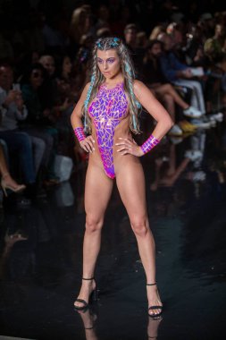A model walks the runway for the Black Tape Project Fashion Show during Art, Hearts, Fashion Swim Week at the Faena Forum in Miami Beach on 7- 11- 2021