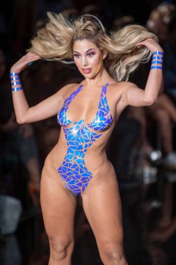 A model walks the runway for the Black Tape Project Fashion Show during Art, Hearts, Fashion Swim Week at the Faena Forum in Miami Beach on 7- 11- 2021