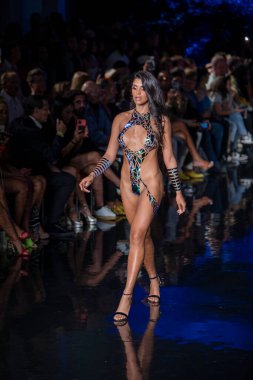 A model walks the runway for the Black Tape Project Fashion Show during Art, Hearts, Fashion Swim Week at the Faena Forum in Miami Beach on 7- 11- 2021
