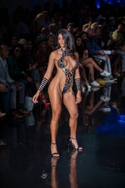 A model walks the runway for the Black Tape Project Fashion Show during Art, Hearts, Fashion Swim Week at the Faena Forum in Miami Beach on 7- 11- 2021
