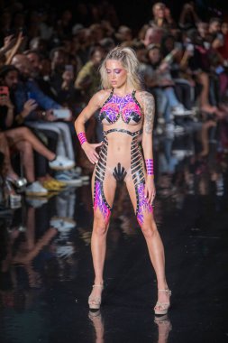 A model walks the runway for the Black Tape Project Fashion Show during Art, Hearts, Fashion Swim Week at the Faena Forum in Miami Beach on 7- 11- 2021