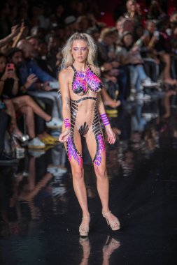A model walks the runway for the Black Tape Project Fashion Show during Art, Hearts, Fashion Swim Week at the Faena Forum in Miami Beach on 7- 11- 2021