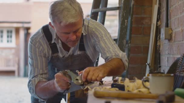 Mature Man Wearing Overalls Garage Workshop Working Piece Wood Vice — Stockvideo
