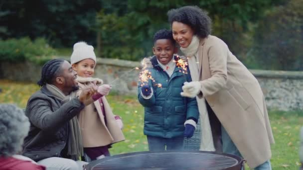 Family Having Fun Sparklers Autumn Garden Home Shot Slow Motion — Stock Video