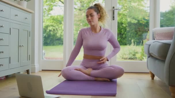 Young Woman Sitting Mat Home Laptop Stretching Online Yoga Class — Stock Video
