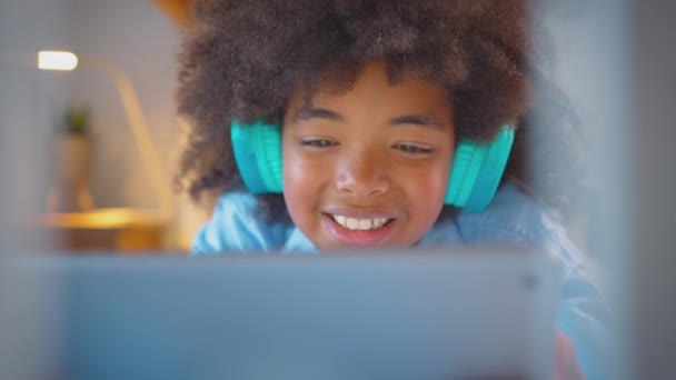 Boy Bedroom Lying Bed Wearing Wireless Headphones Streaming Music Watching — Stock Video