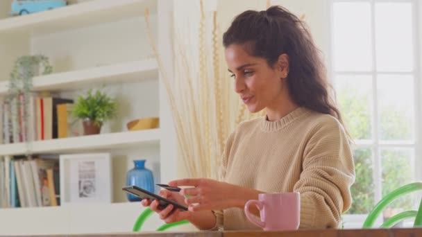 Celebrating Woman Credit Card Home Using Mobile Phone Make Dream — Stock Video