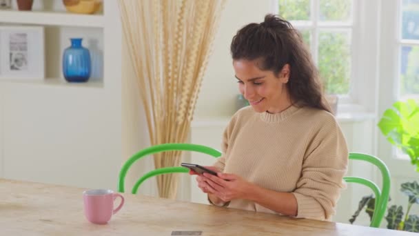 Celebrating Woman Credit Card Home Using Mobile Phone Make Dream — Stock Video