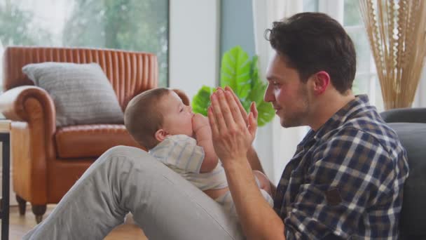 Loving Transgender Father Playing Peek Boo Baby Son Sitting Floor — Stock Video
