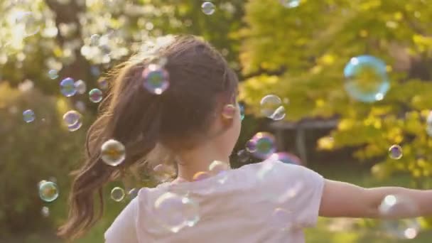Girl Outdoors Having Fun Spinning Playing Bubbles Garden Shot Slow — Stock Video