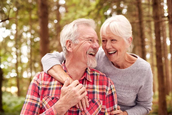 Loving Retired Senior Couple Hugging Walk Woodland Countryside Together — Stockfoto