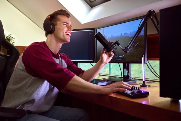 Man Gaming Home Wearing Wireless Headphones Sitting Desk Multiple Monitors — Stockfoto