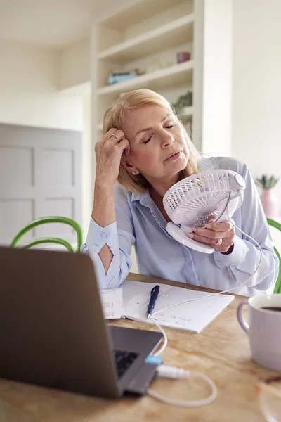 Menopausal Mature Woman Having Hot Flush Home Cooling Herself Fan — Foto Stock