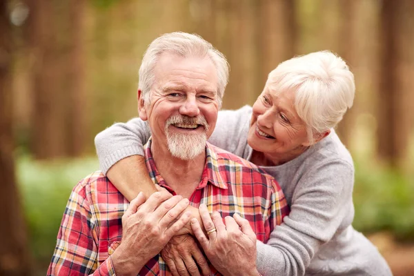Portrait Loving Retired Senior Couple Hugging Walk Woodland Countryside Together — Stockfoto