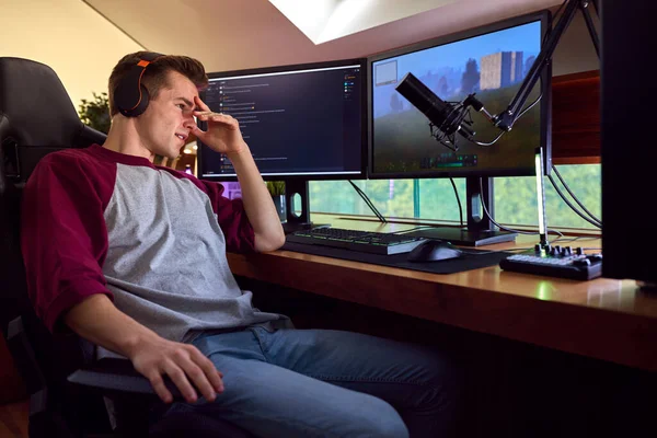 Tired Man Gaming Home Wearing Wireless Headphones Sitting Desk Multiple — Fotografia de Stock