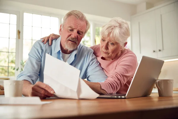 Worried Retired Senior Couple Looking Bills Home Concerned Cost Living — Stockfoto
