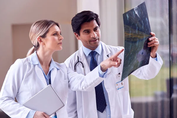 Male Female Doctors Wearing White Coats Standing Hospital Corridor Looking — Stockfoto